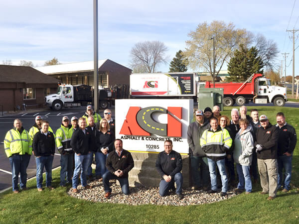 Employee of ACI Asphalt & Concrete, outside of their office in Maple Grove, MN